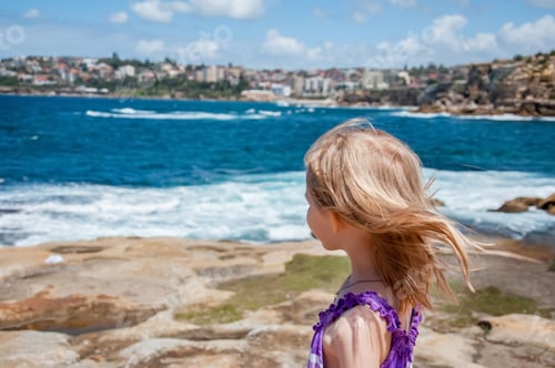 Preview: Girl near the ocean. Travel concept