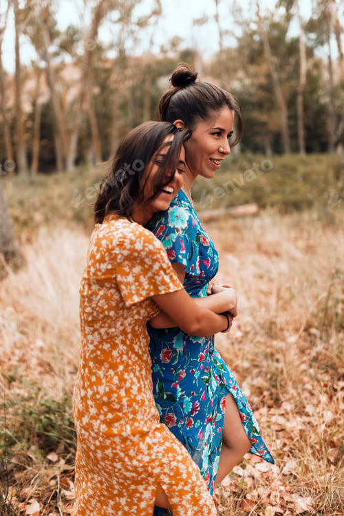 Preview: Two young lesbians caressing each other walking in the woods