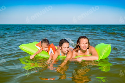 Preview: Family positive mom and two little daughters