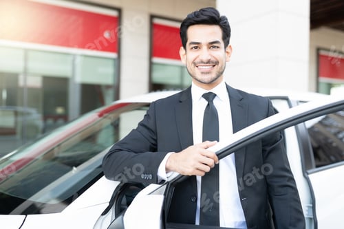 Preview: Smiling Young Businessman With New Car