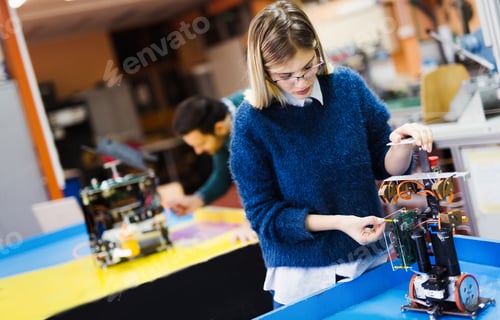 Preview: Young student of robotics working on project