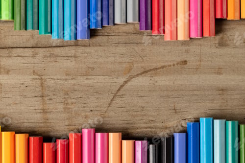 Preview: Composition of colorful crayons on wooden background