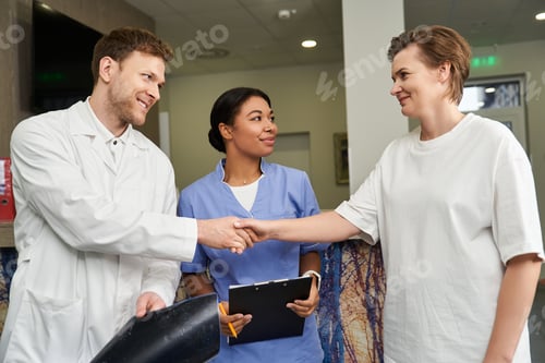 Preview: Healthcare professionals assist patient with MRI scan in modern hospital setting