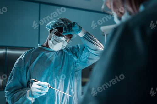 Preview: Surgeons in Scrubs Working in an Operating Room