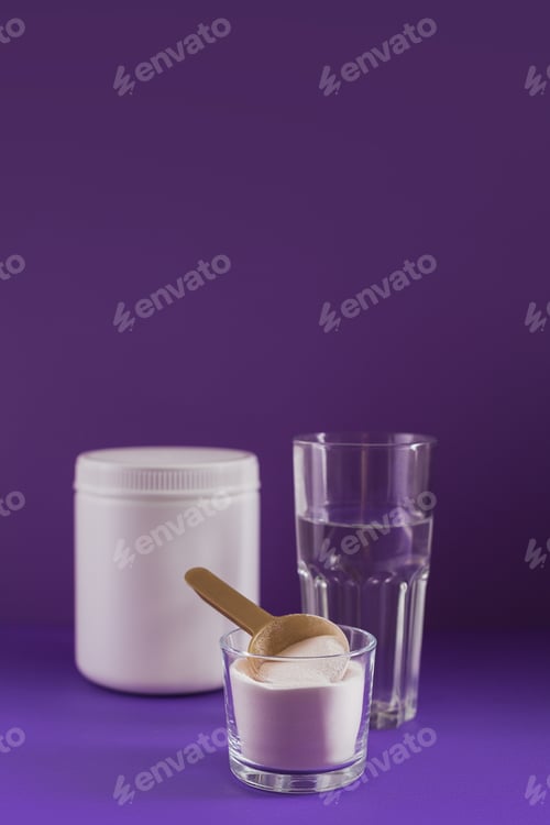 Preview: Collagen powder in bowl, glass of water and measure spoon