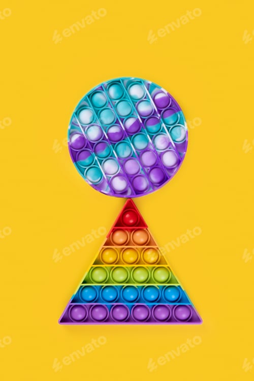 Preview: Two popit toy antistress on a yellow background