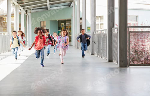 Preview: Elementary school kids running to camera in school corridor