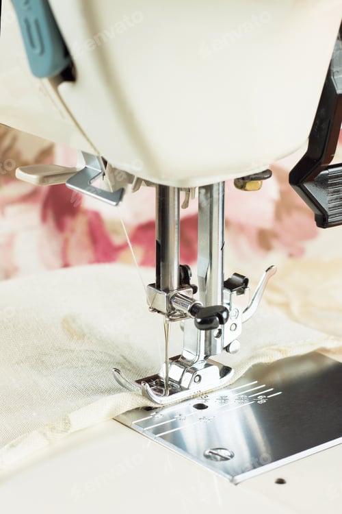 Preview: Modern sewing machine part with item of clothing