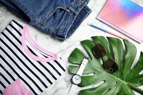 Preview: Flat lay composition with stylish clothes and accessories on marble table. Fashion blogger
