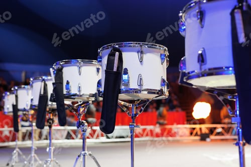 Preview: Drums in the circus arena in the light of colorful spotlights and smoke close-up.