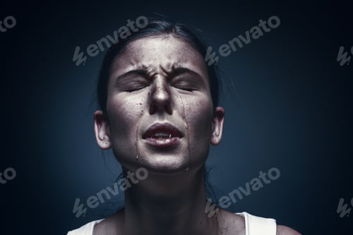 Preview: Close up portrait of a crying woman with bruised skin and black eyes