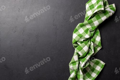Preview: Top-down view of a kitchen table with a towel or napkin