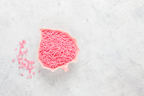 Preview: Pink strawberry chocolate drops and curls pile.