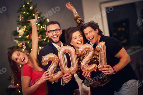 Preview: Two beautiful young couples having fun at New Year's Eve Party