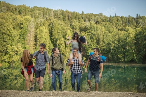 Preview: cheerful hipsters going hiking around the region