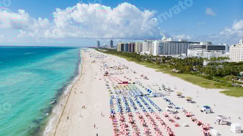Preview: Drone aerial view at Miami South Beach Florida, Beach with colorful chairs and umbrellas