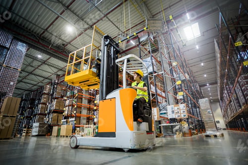 Preview: Forklift operator during work in large warehouse