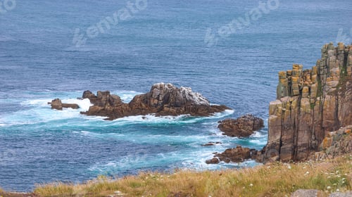 Preview: Rocky shoreline, with the tranquil ocean waters in the background