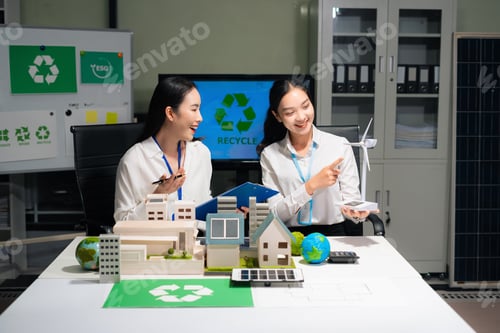 Preview: Two colleagues discussing data Construction Site project, green energy and solar panel concept.