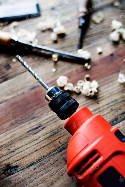 Preview: Drill and Chisel on Wooden Workbench