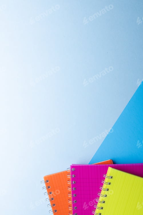 Preview: Three notebooks with binding and copy space on blue background