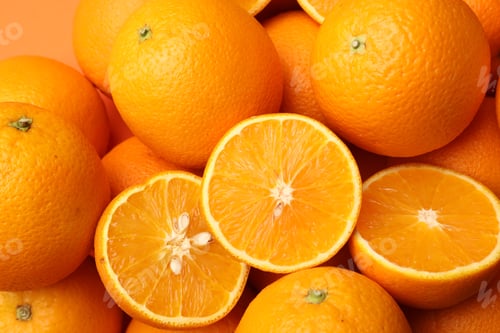 Preview: Fresh cut and whole oranges as background, top view