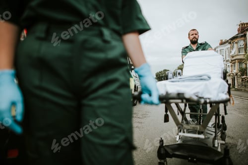 Preview: Paramedic team rolling a stretcher on a street