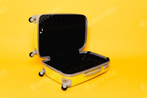Preview: open empty travel bag on yellow background