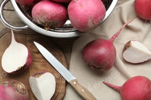 Preview: Red turnips and knife on wooden table, flat lay