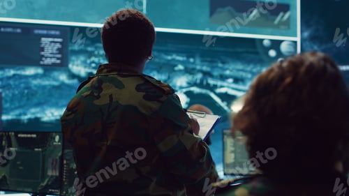 Preview: Female brigadier general gather intelligence reports on a big screen