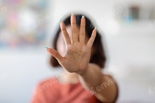 Preview: Unrecognizable Young Woman Covering Her Face With Open Palm, Showing Stop Gesture