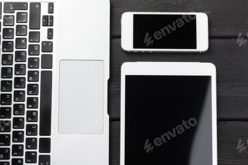 Preview: Open laptop with digital tablet and smartphone close up
