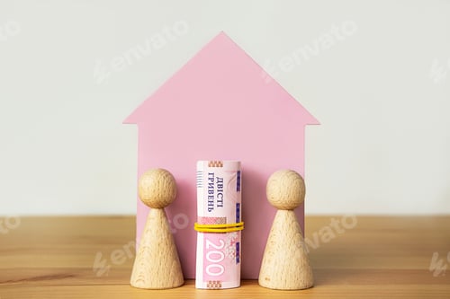 Preview: Family concept. Wooden house, Ukrainian hryvnia and wooden men on a light background.Rising prices.