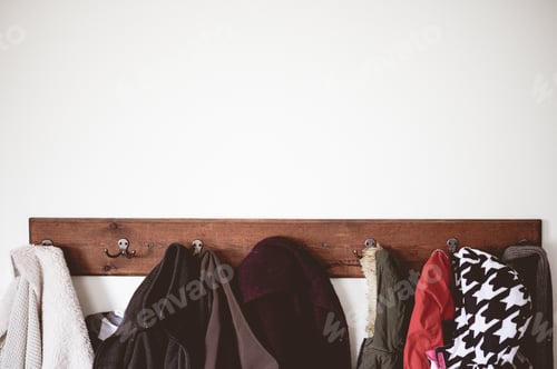 Preview: Coats and Jackets Hanging on Wooden Wall Rack