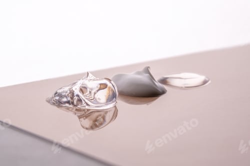 Preview: Cream, hyaluronic gel and serum on a beige background.