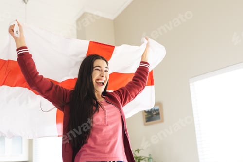 Preview: Enthusiastic Woman Celebrates Holding a Red and White Flag