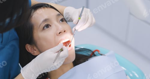 Preview: Woman undergo check up of tooth in dental clinic