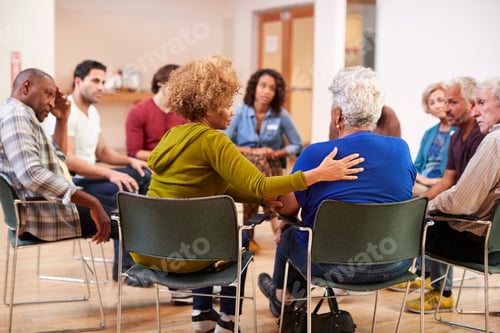 Preview: People Attending Self Help Therapy Group Meeting In Community Center