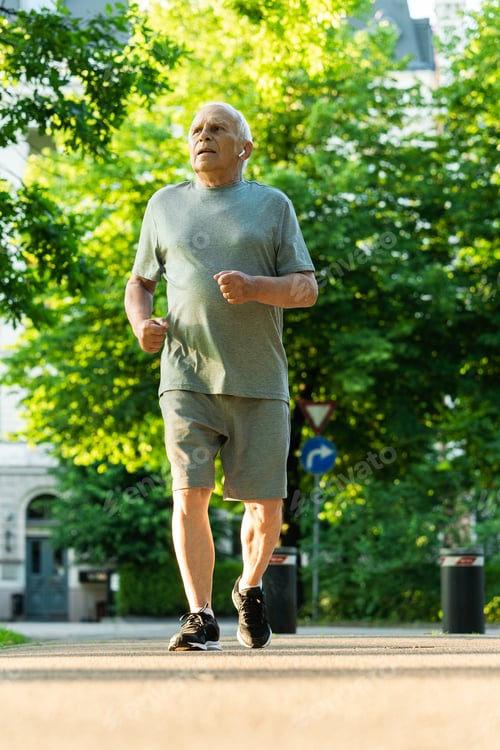 Preview: Elderly man during his jogging workout in a city park