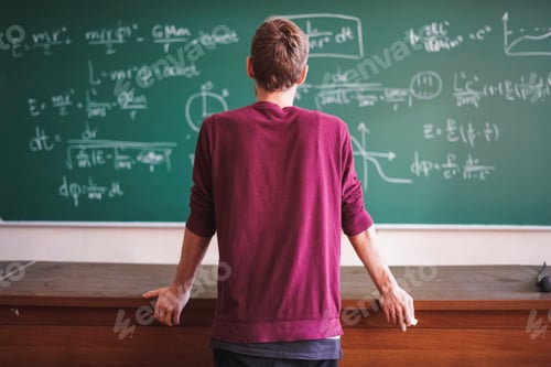 Preview: close up portrait of young bearded professor teacher in casual with blackboard with formulas behind