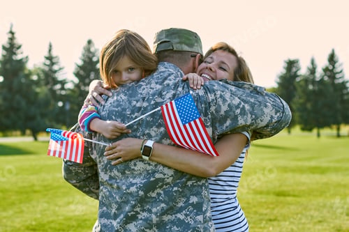 Preview: Happy soldier with his family in the sunny day.