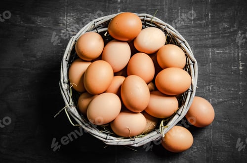 Preview: Fresh chicken eggs in basket.