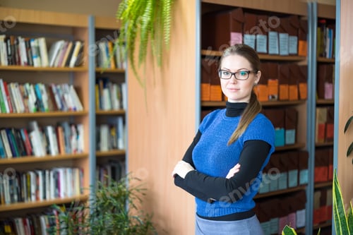 Preview: Portrait Of Clever Student In College Library
