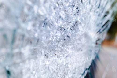Preview: Glass of a broken and cracked commercial showcase.
