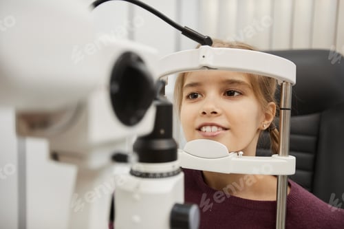 Preview: Cute Girl Using Vision Test Machine