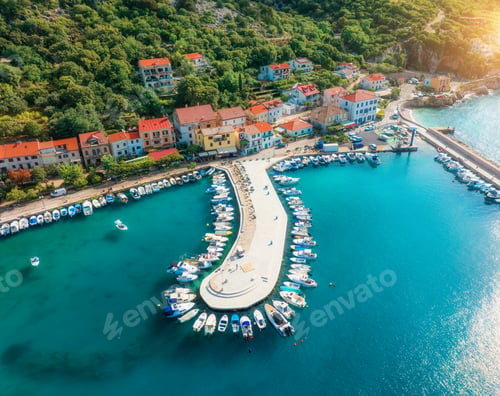 Preview: Aerial view of boats and yachts, buildings at summer sunset