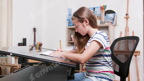 Preview: Little child painter drawing creative sketch using graphic pencil
