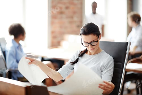 Preview: Woman working with documents at office
