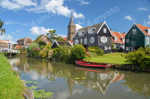 Preview: Closeup shot of town houses on a river bank on a sunny day