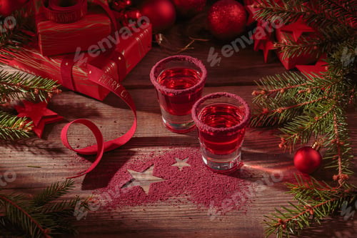 Preview: Two glasses of red liqueur on wooden background